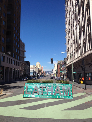 Oakland's Latham Square Plaza sign blocks car traffic from bisecting the pedestrian plaza.