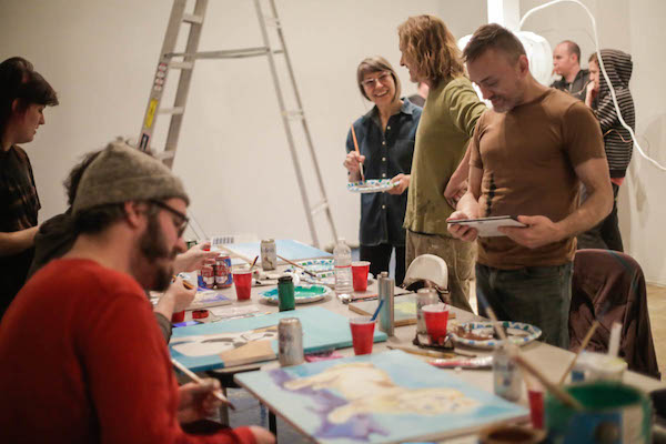 Members of the weekly sketch club, Children of Artemis, meet at CentralTrak to paint their versions of George W. Bush paintings. 
