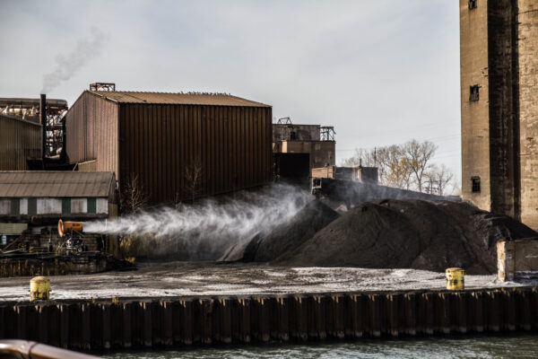 At the Headwaters, Petcoke piles along the Calumet, photograph by Koy Suntichotinun, 2016. Photo courtesy of artists.